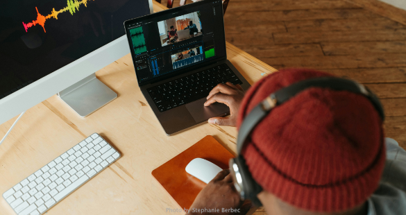 Professional using connected business applications on a laptop