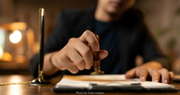 Business professionals verifying information before approving a request