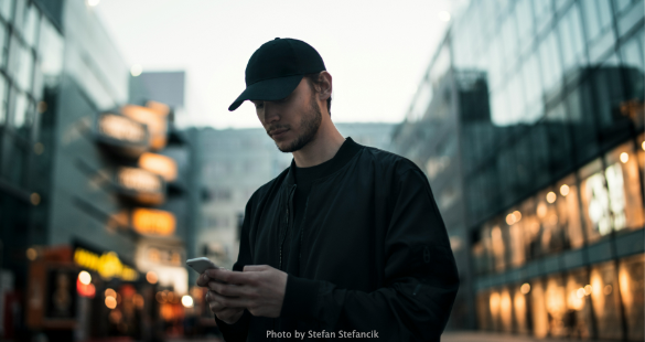 Person using a smartphone while navigating an urban service
