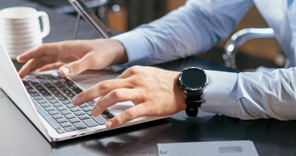 Security professional prioritising account exposure alerts on a laptop